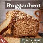 Angeschnittenes Roggenbrot aus der Kastenform mit Sonnenblumenkernen auf einem Holzbrett